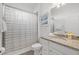 Bathroom with granite countertops, white cabinets, and a shower-tub combo at 6535 Clairborne Ln, Bradenton, FL 34211