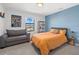 Vibrant bedroom featuring a colorful accent wall and cozy furnishings at 6535 Clairborne Ln, Bradenton, FL 34211
