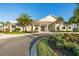 Beautiful community clubhouse featuring manicured landscaping, a covered entry, and ample parking at 6535 Clairborne Ln, Bradenton, FL 34211