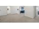 Bright hallway with neutral carpet that leads to various rooms in the home at 6535 Clairborne Ln, Bradenton, FL 34211