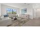Bright living room with view of screened patio, and contemporary furnishings at 6535 Clairborne Ln, Bradenton, FL 34211