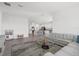 Bright living room with view of kitchen, and contemporary furnishings at 6535 Clairborne Ln, Bradenton, FL 34211