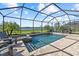 Screened in pool with a spa and comfortable seating overlooking a beautiful lake view at 6535 Clairborne Ln, Bradenton, FL 34211