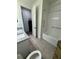 Well-lit bathroom featuring a granite-topped vanity, toilet, and a separate shower over tub at 7322 34Th E Ct, Sarasota, FL 34243