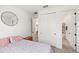 Bedroom with neutral carpet and patterned bedding, and access to other rooms in the home at 7322 34Th E Ct, Sarasota, FL 34243