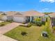 Beautiful single story home with a well maintained lawn, landscaping, and a brick driveway at 7322 34Th E Ct, Sarasota, FL 34243