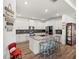 Bright kitchen features granite counters, stainless appliances, and an island with seating at 7322 34Th E Ct, Sarasota, FL 34243