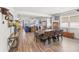 Spacious open-concept dining and living area with plenty of natural light and modern furnishings at 7322 34Th E Ct, Sarasota, FL 34243