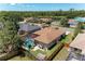An aerial view of the backyard featuring a sparkling pool with a screened enclosure at 7814 48Th E Ave, Bradenton, FL 34203