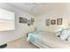 Inviting bedroom with floral accents, carpeted floors, and a window offering natural light at 7814 48Th E Ave, Bradenton, FL 34203