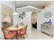 Cozy breakfast nook with four chairs and table setting at 7814 48Th E Ave, Bradenton, FL 34203
