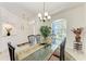 Bright dining area with glass table and seating for four at 7814 48Th E Ave, Bradenton, FL 34203