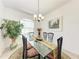 Dining area with glass table and seating for four at 7814 48Th E Ave, Bradenton, FL 34203