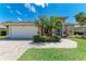 Charming single-Gathering home with a well-manicured lawn, lush landscaping, and a two-car garage at 7814 48Th E Ave, Bradenton, FL 34203