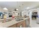 Bright kitchen with breakfast bar overlooking living room at 7814 48Th E Ave, Bradenton, FL 34203