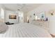 Spacious main bedroom with wood floors, en suite bathroom, view to backyard and plenty of natural light at 7814 48Th E Ave, Bradenton, FL 34203