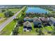 Aerial view featuring backyard with patio, hot tub, and proximity to the lake at 8243 Nandina Dr, Sarasota, FL 34240