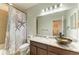 Bathroom featuring stylish vanity with dark wood cabinets and vessel sink at 8243 Nandina Dr, Sarasota, FL 34240