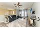 Bonus room with exercise equipment, seating, and a mounted television at 8243 Nandina Dr, Sarasota, FL 34240