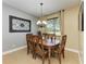 Elegant dining room with stylish lighting, beautiful furniture, and neutral color palette at 8243 Nandina Dr, Sarasota, FL 34240