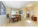 Formal dining room with elegant table, chairs, chandelier, and tile flooring at 8243 Nandina Dr, Sarasota, FL 34240