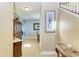 Inviting foyer with staircase, neutral walls, tile floor and decorative table at 8243 Nandina Dr, Sarasota, FL 34240