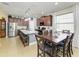 Eat-in kitchen with a large island, stainless steel appliances, and open to the dining area at 8243 Nandina Dr, Sarasota, FL 34240