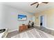 Comfortable living space with a wall-mounted TV and wood-look floors at 8243 Nandina Dr, Sarasota, FL 34240