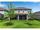 Spacious backyard with well-maintained lawn and screened-in lanai, great for outdoor enjoyment at 8346 Abalone Loop, Parrish, FL 34219