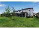 Large grassy backyard featuring a screened-in lanai, perfect for Gathering gatherings and entertaining at 8346 Abalone Loop, Parrish, FL 34219