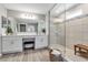 Bright bathroom featuring a large shower, double vanity, and wood-look flooring at 8346 Abalone Loop, Parrish, FL 34219