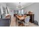 Bright dining room featuring wood table, modern lighting, and stylish furnishings at 8346 Abalone Loop, Parrish, FL 34219