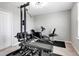 A home gym with equipment including a bench, exercise bike, and weight lifting machine at 8346 Abalone Loop, Parrish, FL 34219