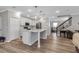 Modern kitchen with white cabinets, quartz countertops, and stainless steel appliances at 8346 Abalone Loop, Parrish, FL 34219