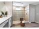 Bright tiled shower with glass door and window at 8346 Abalone Loop, Parrish, FL 34219