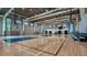 A spacious indoor basketball court featuring polished hardwood floors and modern hoops for athletic activities at 8505 Snowfall St, Sarasota, FL 34241