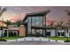 Elegant clubhouse exterior boasting a modern design, large windows, and meticulously manicured lawns at 8505 Snowfall St, Sarasota, FL 34241