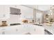 Modern kitchen design showcasing stainless steel appliances, white cabinets, and stylish pendant lighting at 8505 Snowfall St, Sarasota, FL 34241