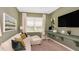 Cozy living room with a workspace, computer, modern decor, and plenty of natural light at 8505 Snowfall St, Sarasota, FL 34241