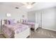 Charming bedroom with two twin beds, a ceiling fan, and neutral walls for versatile decor options at 9095 Rally Spring Loop, Wesley Chapel, FL 33545