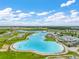Overhead shot of a dazzling lagoon with sparkling waters, designed for relaxation, recreation, and community enjoyment at 9095 Rally Spring Loop, Wesley Chapel, FL 33545