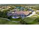 Aerial view of country club, putting green, golf carts, and outdoor dining at 9630 Club South Cir # 6201, Sarasota, FL 34238