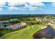 Panoramic aerial view of golf course, residential area, lakes, and coastal views at 9630 Club South Cir # 6201, Sarasota, FL 34238