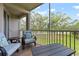 Relaxing screened in balcony area with chairs and a table at 9630 Club South Cir # 6201, Sarasota, FL 34238