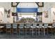 Elegant bar with multiple seating, granite countertop, and a well-stocked drink selection at 9630 Club South Cir # 6201, Sarasota, FL 34238