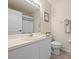 Bright bathroom featuring a sink, toilet, towel rack and framed picture at 9630 Club South Cir # 6201, Sarasota, FL 34238
