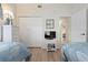 Shared bedroom features two twin beds with coastal decor and light wood flooring at 9630 Club South Cir # 6201, Sarasota, FL 34238