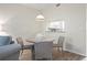 Cozy dining area with seating for four, featuring a pass-through window to the kitchen with modern appliances at 9630 Club South Cir # 6201, Sarasota, FL 34238