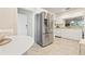 Spacious kitchen features stainless steel appliances, granite countertops, white cabinetry, and an adjacent breakfast nook at 9630 Club South Cir # 6201, Sarasota, FL 34238