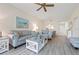 Comfortable living room with cozy seating, a scenic painting, and a glimpse of the dining area, creating a welcoming space at 9630 Club South Cir # 6201, Sarasota, FL 34238